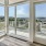 a room with windows and a view of the city