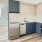 a kitchen with blue cabinets