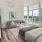 a bedroom with a large window
