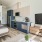 a living room with a tv and couches